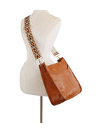 Front Pocket Stylized Strap Shoulder Bag — Handbag Factory Corp