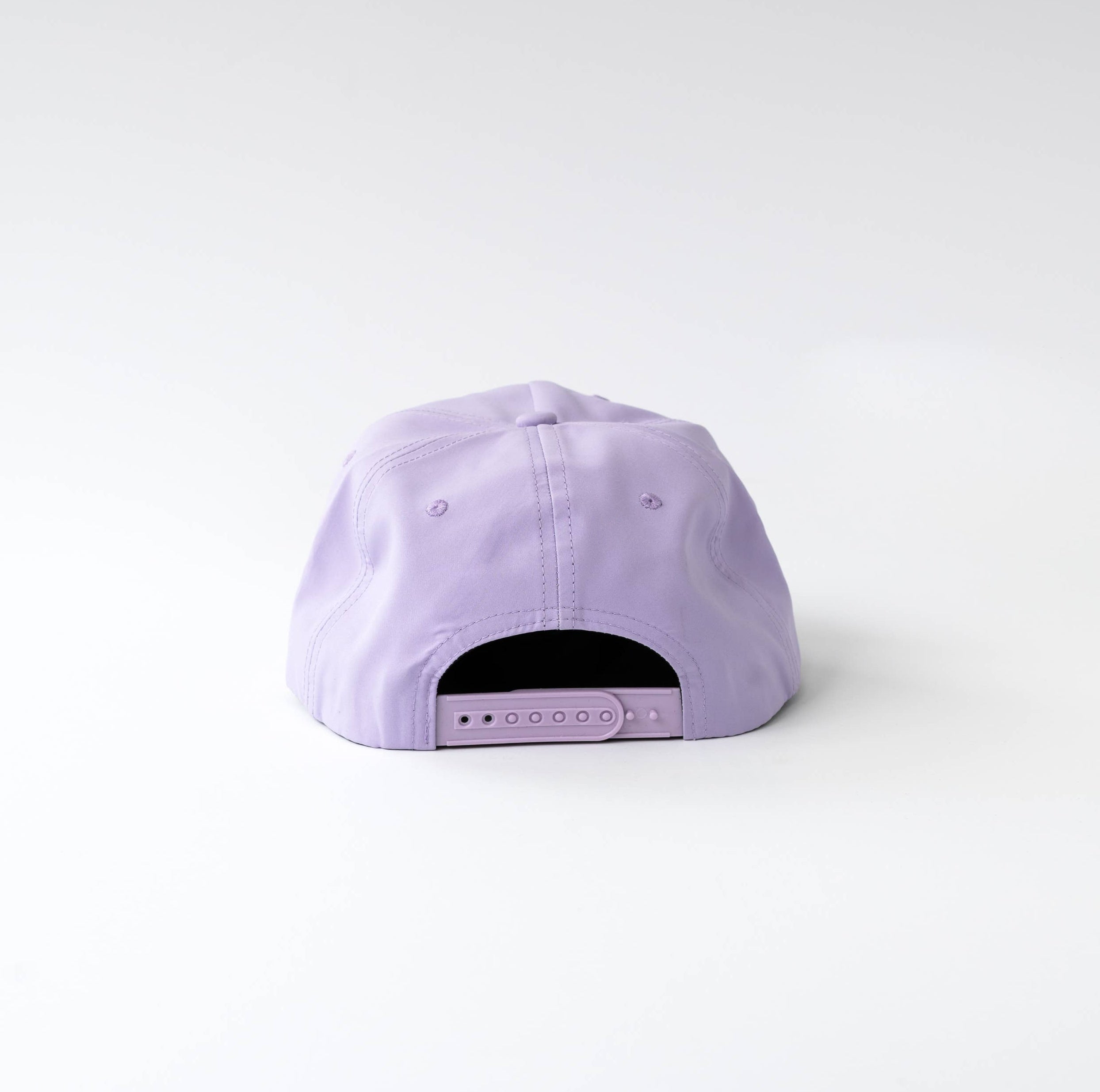 A light purple baseball cap viewed from the back, centered against a clean white studio background.